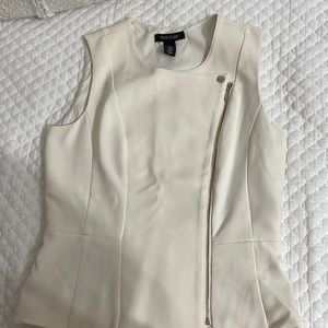 Dress vest with gold zipper and button. The color is off white.